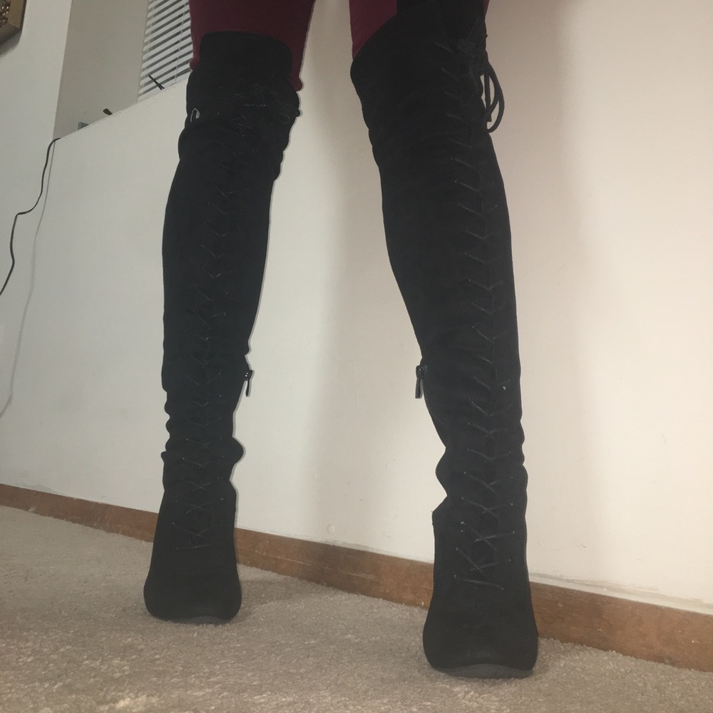 Thigh high black boots with tie up laces